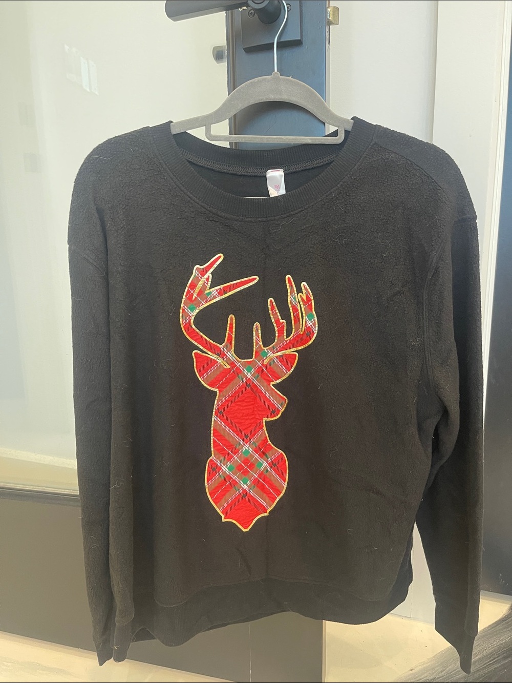 No Boundaries Black Crewneck Sweater with Red Plaid Deer Appliqué